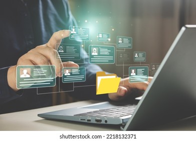 HR concepts and personal file storage, personal information management, checklists. Businessmen working in HR checklists of employees or job applicants through a virtual screen from tablet computer.