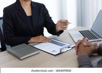 The HR department head is asking questions about the job history and career prospects for the job. Inside the job interview room, application submission ideas, and job interviews. - Shutterstock ID 1844099830