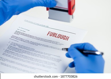 HR Hand In Blue Protective Glove Stamping FURLOUGH Notice Letter,temporary Unpaid Leave,absence Of Employees Due To Lack Of Work In Company,UK Government Measure To Help Laid Off Staff During Lockdown