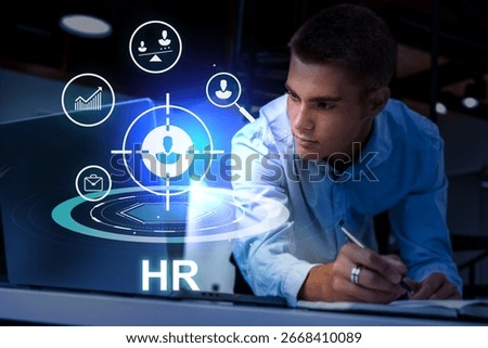 HR professional analyzing data and engaging with technology in a modern office setting