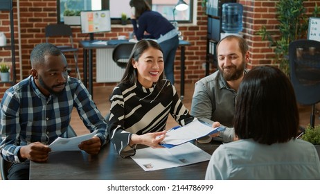 HR workers hiring woman and making employment deal, signing work contract after successful job interview. Female applicant getting hired at business company, joining executive team. - Shutterstock ID 2144786999
