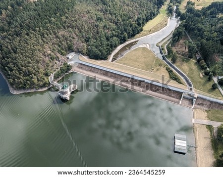 The Hracholusky concrete dam with water power plant.water reservoir on the river Mze. Source of renewable energy and popular recreational area in Bohemia. Czech Republic, Europe.aerial, green water
