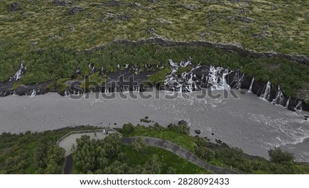 Hraunfossar Cascades Flowing Down the Side of a Cliff