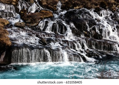 Hraunfossar in western Iceland is a series of waterfalls formed by rivulets streaming out of the Hallmundarhraun lava field.