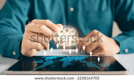HRM human resource management concept, executive holding a magnifying glass to search for effective personnel, human resource management in the organization, human development and recruitment.