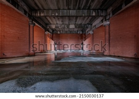 Hrodna Region, Belarus-April 2022: The interior of an unfinished red brick Catholic church after rain.
