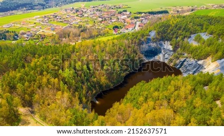 Hromnice jezirko or Red Lake with its aggressive acidic water. Former vitriol slate quarry. Natural and industrial heritage monument. Famous landmark from early days of Czech chemical industry.