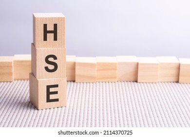 HSE Written In Wooden Cubes. Business Conceptual Word Collected Of Of Wooden Elements With The Letters. HSE - Short For Health And Safety Executive