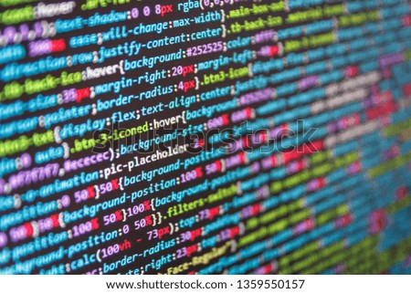 HTML code on the screen editor, dark screen. Real software development code. Abstract software process. Mobile app concept. Tech source apps. Software data monitor new function. 