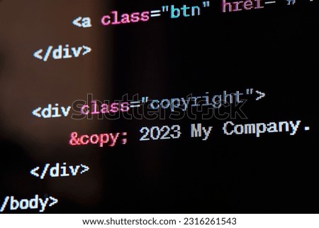 HTML website source code on the screen.