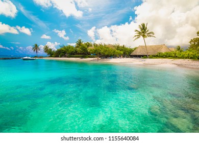 Huahine, French Polynesia. South Pacific. Tropical Vacation Landscape With Lagoon, White Sandy Beach And Palm Trees On The Island.