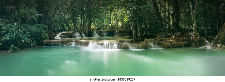 Huai Mae Khamin Waterfall in tropical rainforest with rock and turquoise blue pond has 7 tiers, Seven leveled falls are one of most beautiful waterfalls in Thailand. Khuean Srinagarindra National Park
