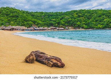Huatulco bays - Maguey beach. Beautiful beach with pristine waters, with turtles and fishes. Mexican beach with wooden huts by the sea - Shutterstock ID 2173775517