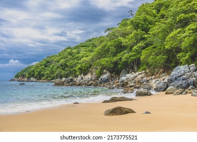 Huatulco bays - Maguey beach. Beautiful beach with pristine waters, with turtles and fishes. Mexican beach with wooden huts by the sea - Shutterstock ID 2173775521