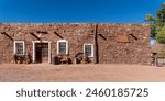 Hubbell Trading Post National Historic Site in Arizona. Meeting ground of two cultures between the Navajo and the settlers who came to the area to trade. Historic building and sign. 