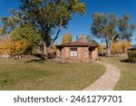 Hubbell Trading Post National Historic Site in Arizona. Hogan of logs and earth was the traditional Navajo housing. Octagon shaped hogan was used as a guest house for visitors, artist in residence.