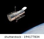 The Hubble Space Telescope in orbit above the Earth. Elements of this image furnished by NASA. 