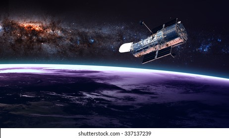 The Hubble Space Telescope In Orbit Above The Earth. Elements Of This Image Furnished By NASA.