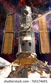 The Hubble Space Telescope In Orbit Above The Earth. Elements Of This Image Furnished By NASA.