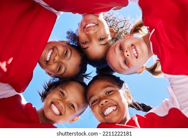 Huddle, girl team or friends in soccer planning for football strategy with teamwork, sports goal or smile at stadium. Happy kids, low view or children excited for fitness, training or workout game - Powered by Shutterstock