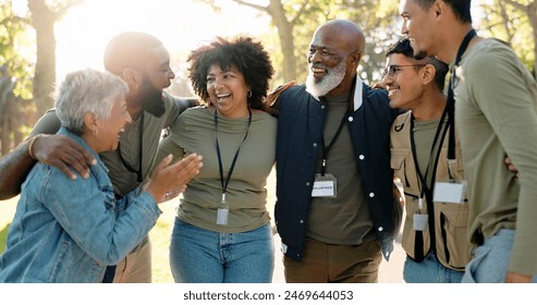 Huddle, happy and volunteer group outdoor with collaboration, teamwork and donation for charity work. Hug, smile and ngo people in park with cooperation, commitment and community service for change - Powered by Shutterstock