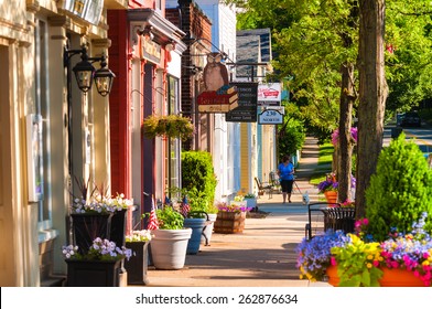 HUDSON, OH - JUNE 14, 2014: Quaint shops and businesses dating back more than a century line Hudson's Main Street looking north.