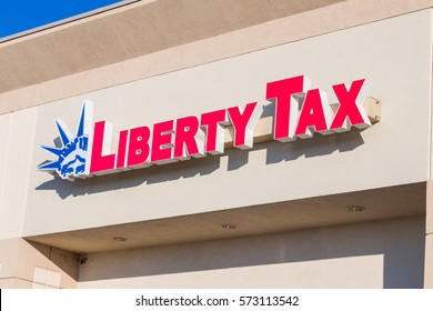 HUDSON, WI/USA - FEBRUARY 5, 2017: Liberty Tax Service Exterior Sign And Logo. Liberty Tax Service Specializes In The Preparation Of Tax Returns For Individuals And Small Businesses.