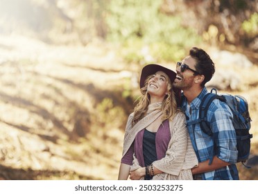 Hug, couple and happy outdoor for hiking in nature on vacation, together and walking in forest for adventure. Man, woman and smile in woods for explore on travel holiday in New Zealand with space. - Powered by Shutterstock