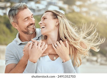 Hug, happy man and woman at beach for love, trust and care or support for relationship. Together, couple and laughing in nature for date or travel, marriage and joke or humour for outdoor adventure - Powered by Shutterstock