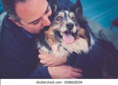 Hug With Love Between Man Owner And Border Collie. True Affection Between Human And Dog, Firendship Forever Concept With Focus On Eyes