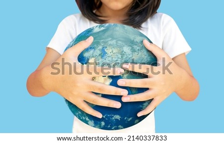 Hug on earth show love global on earthday concept  kids model and earth oisolated background. ecology concept. symbolic earth to Elements of this image furnished by NASA (include path)