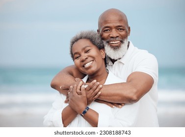 Hug, portrait and a senior couple at the beach for a vacation, retirement travel and walking. Smile, love and an elderly man and woman hugging with affection on a date by the ocean in Portugal - Powered by Shutterstock