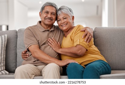 Hug, portrait and senior couple on the sofa in the living floor to relax during retirement in their house. Happy, smile and love from elderly man and woman with affection on the couch in their home - Powered by Shutterstock