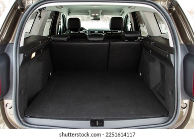 Huge, clean and empty car trunk in interior of compact suv. Rear view of a SUV car with open trunk - Shutterstock ID 2251614117