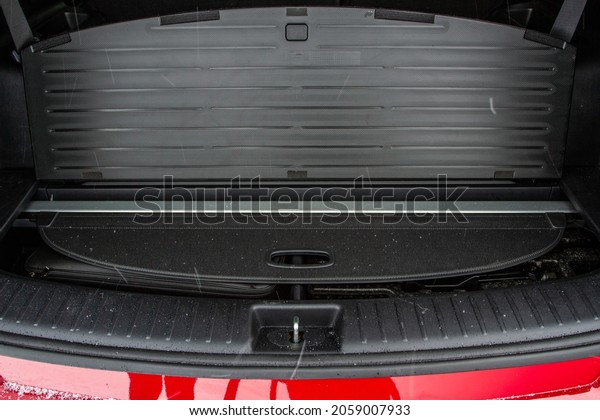 Huge, clean and empty car trunk in interior of\
a modern compact suv. Rear view of a SUV car with open trunk. Car\
trunk interior.