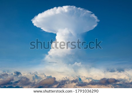 Huge cloud that looks like nuclear explosion. Cumulonimbus cloud is amazing, beautiful and dangerous natural phenomenon.