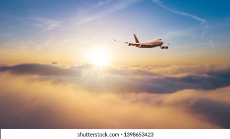 Huge Commercial Airplane Flying Over Dramatic Sunset Sky. Jet Plane Is The Fastest Mode Of Modern Transportation.