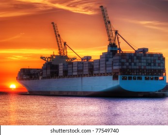 Huge Container Cargo Ship At Sunrise