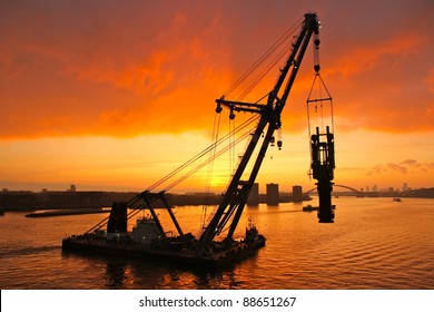 Huge Crane Barge Doing Marine Heavy Lift  Installation Works In The Port Of Rotterdam.