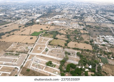 huge deforested fields invaded by urban sprawl. settlement. new residential subdivision. Arid and decertic land.