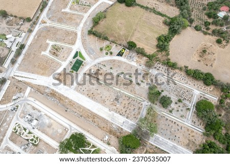 huge deforested fields invaded by urban sprawl. settlement. new residential subdivision. Arid and decertic land.