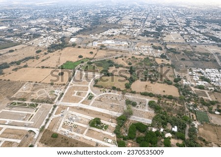 huge deforested fields invaded by urban sprawl. settlement. new residential subdivision. Arid and decertic land.