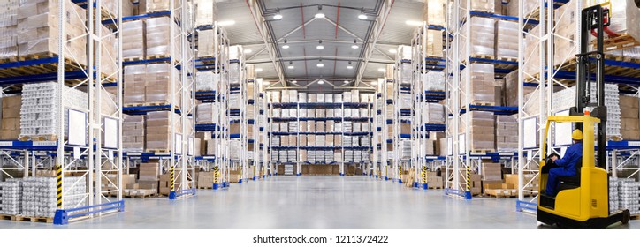 Huge distribution warehouse with high shelves and forklift. Bottom view.