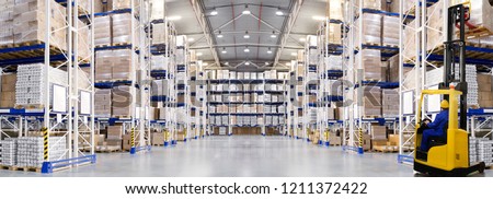 Huge distribution warehouse with high shelves and forklift. Bottom view.