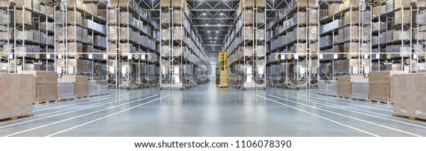 Huge distribution warehouse with high shelves and\
loaders. Bottom view.