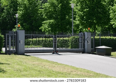huge double sided gate with orange lights on both sides
