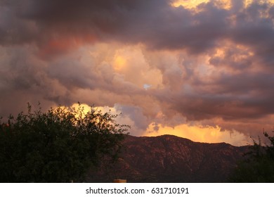 Huge dramatic foreboding purple pink orange yellow Monsoon Clouds at Sunset over the Tucson Arizona Catalina mountains - Shutterstock ID 631710191
