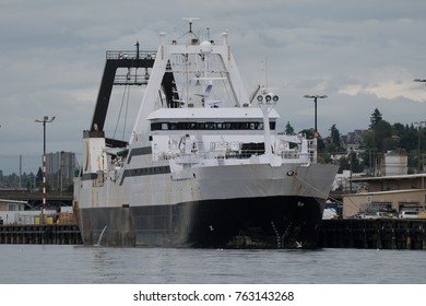 Huge Factory Trawler Tied Up To The Pier In Seattle On Cloudy, Flat Lit Day