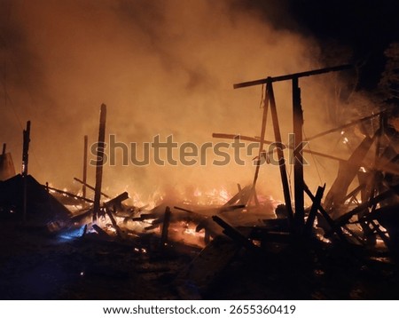 a huge fire engulfed the housing complex, razing it to the ground 