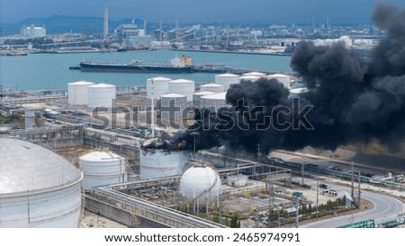 Huge fire exploding smoke at a chemical storage tank in Oil Refinery Plant. as the blaze was likely to spread. Storage tank of Pyrolysis gas exploding.